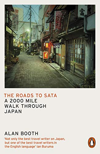 Book cover depicting a narrow, brick-paved street in a Japanese town.