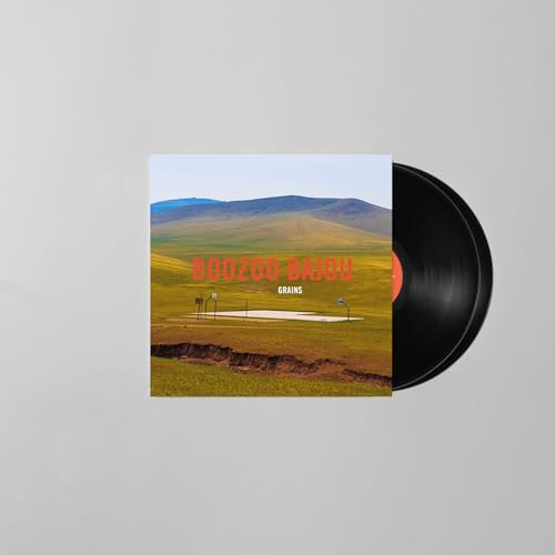 Vinyl record and album cover with a landscape scene.