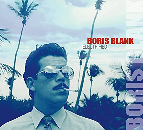 CD cover: man with sunglasses smoking, palm trees in background.