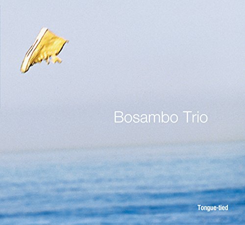 CD cover with a yellow shoe in the air over blue water.