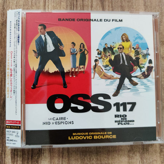 CD case for "OSS 117: Le Caire, Nid D'espio" with a retro film poster.