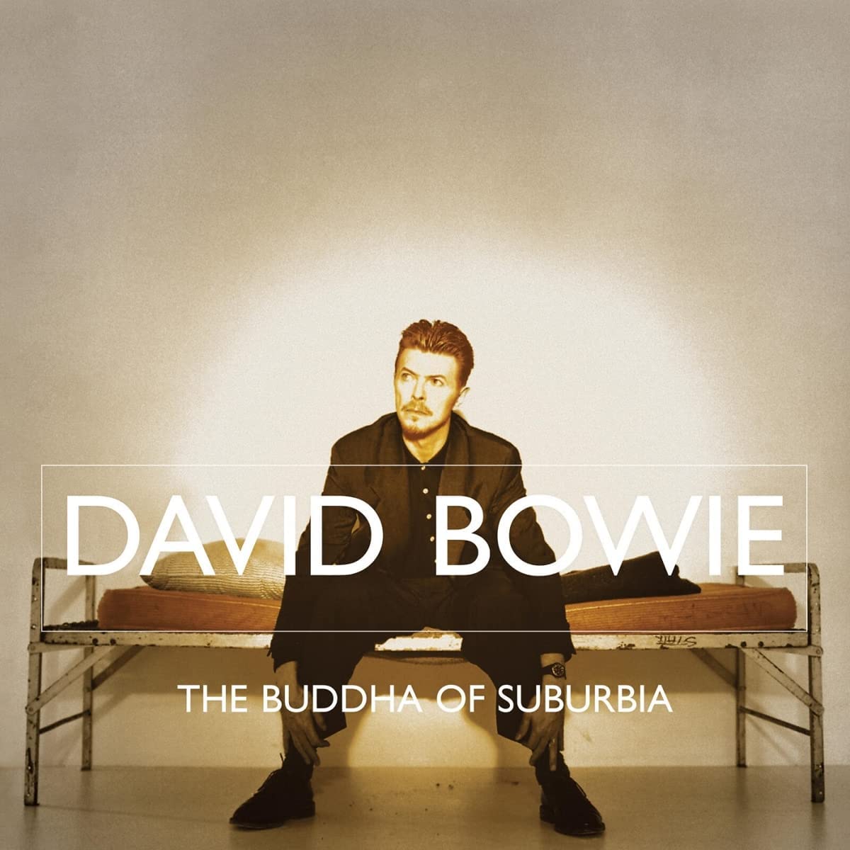 David Bowie album cover featuring a man sitting on a bench with text overlay.