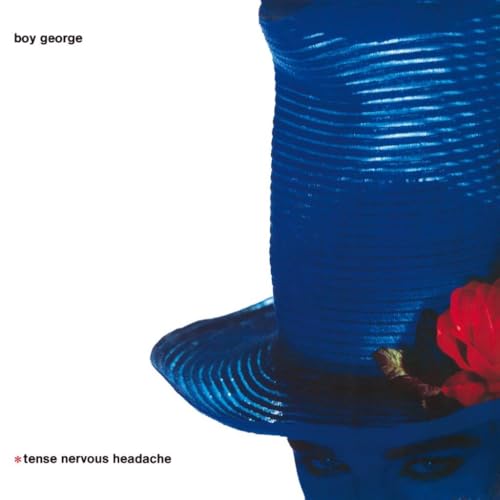 Boy George album cover: blue hat, red flower, partial face.