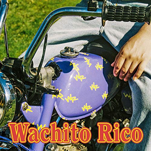 A purple motorcycle gas tank with yellow "WR" logos and red title text "Wachito Rico".