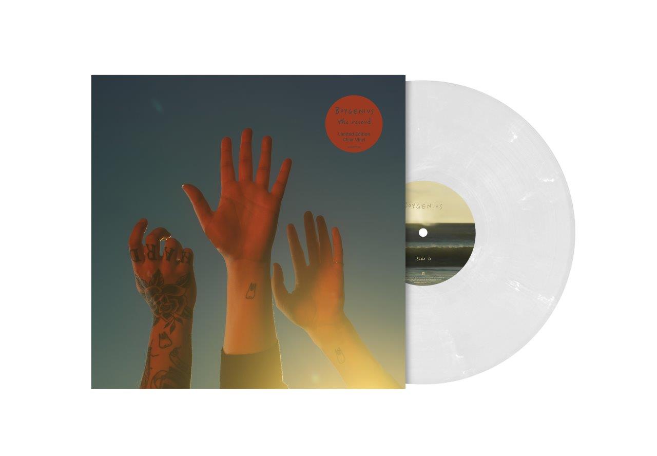 "Clear vinyl record with cover featuring three raised hands against a gradient background."