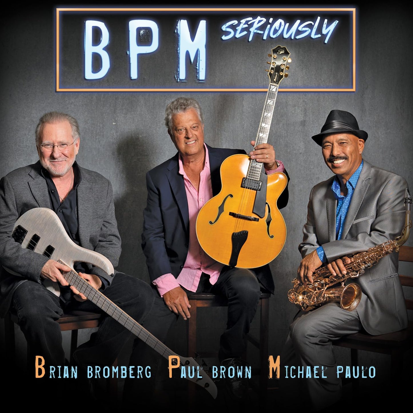 CD cover featuring four musicians with guitars and a saxophone.