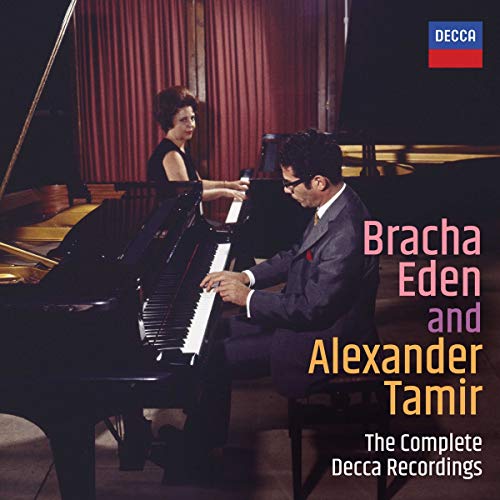 Bracha Eden and Alexander Tamir performing at two grand pianos.