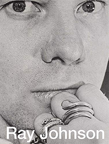 Black and white close-up portrait of Ray Johnson with rings on his hand.