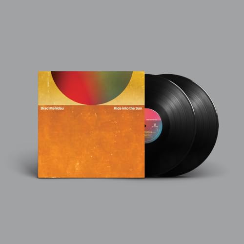 Brad Mehldau’s “Ride into the Sun” double vinyl record with orange cover.