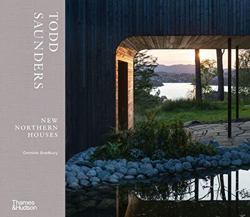 Book cover featuring a modern dark-wood house overlooking a lake at sunset.