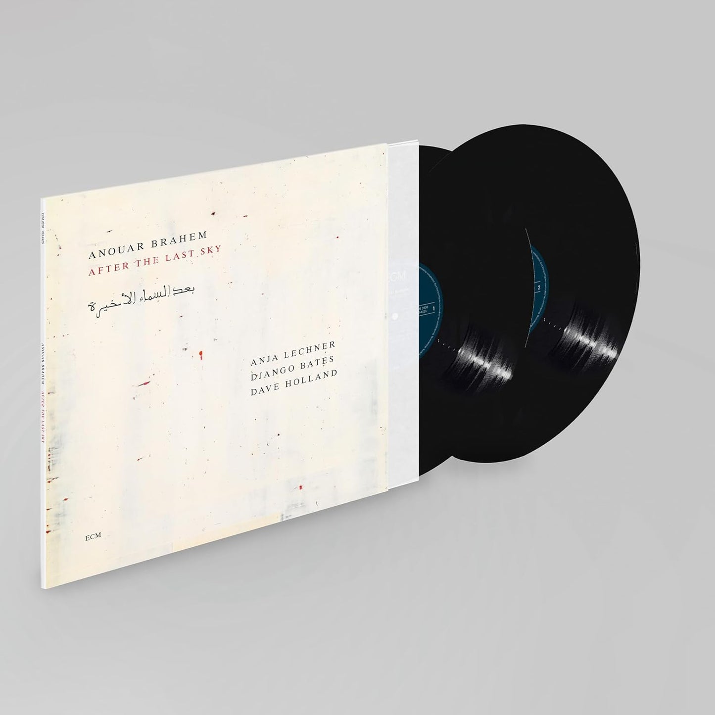 Vinyl record with beige cover featuring text and abstract red shapes.