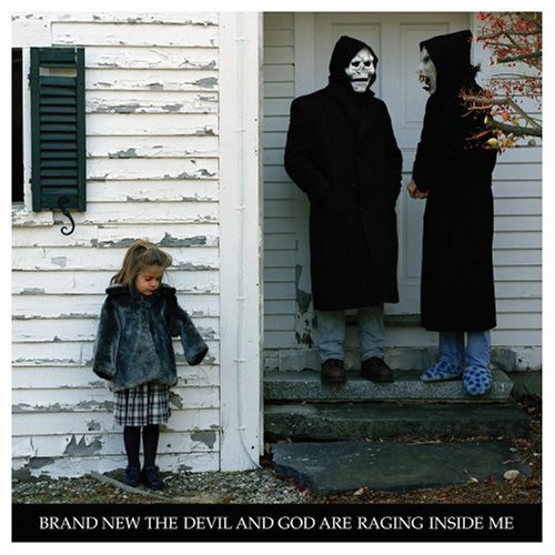 CD cover: two figures in masks and a child stand in a doorway.