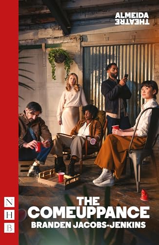 Four people with red plastic cups sit in a room with industrial decor.