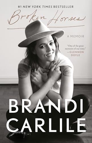 Book cover: “Broken Horses” memoir by Brandi Carlile, woman in hat.