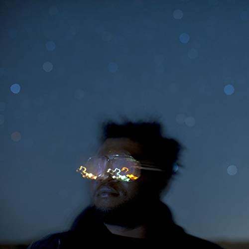 Brandon Coleman album cover: man with glowing glasses, dark background.