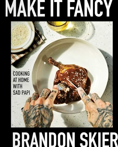 Cookbook cover with food, tattooed hands, and title “Make It Fancy.”