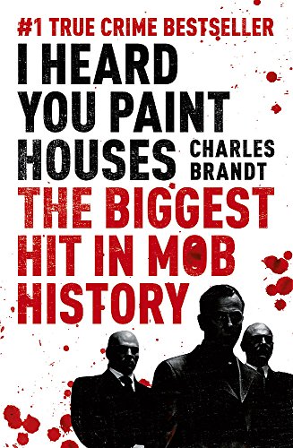 Book cover with red text and silhouetted figures in suits.