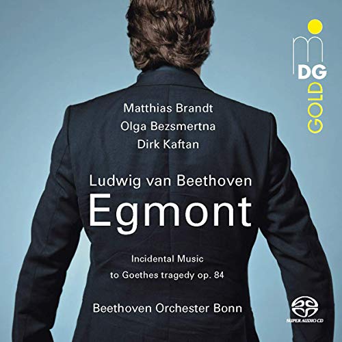 CD cover featuring a man in a black suit against a blue background.