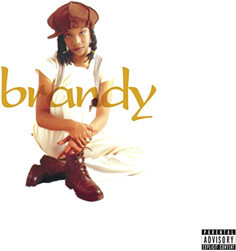 Brandy album cover featuring the singer in a cap and boots.