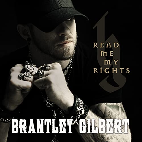 Brantley Gilbert album cover, featuring a man with tattoos and jewelry.