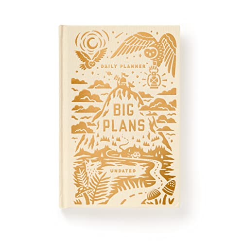 Beige planner with gold foil illustration of mountains and wildlife.