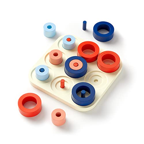 Tic Tac Pro game set with colorful rings and pegs on a board.