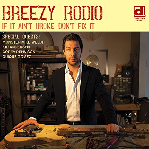 Breezy Rodio album cover featuring a man with a guitar in a workshop.