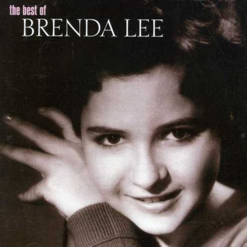 Black and white portrait of Brenda Lee, close-up, smiling gently.