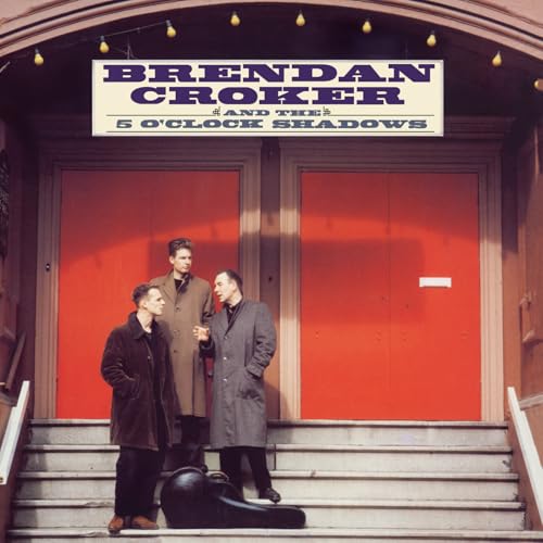 Album cover featuring three men in coats standing in front of red doors.