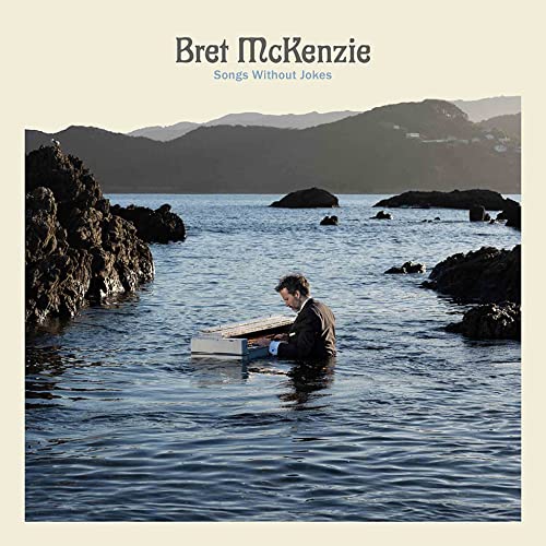 Bret McKenzie album cover: man playing piano in shallow ocean water.