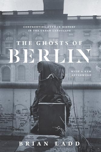 Book cover featuring a seated figure before a graffitied wall.