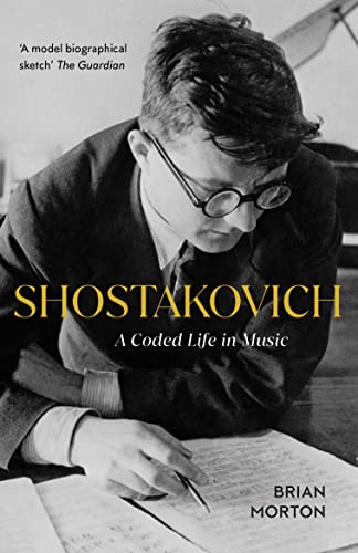 Black and white photo of composer Shostakovich writing music, with book title text overlaid.
