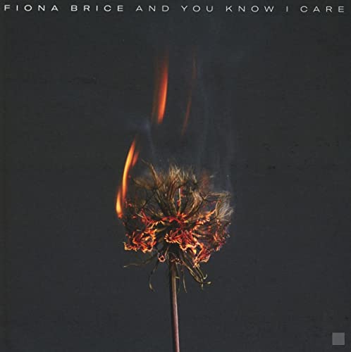 CD cover: burning flower against a dark gray background.