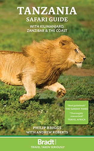Book cover featuring a male lion running through grass with title Tanzania Safari Guide.