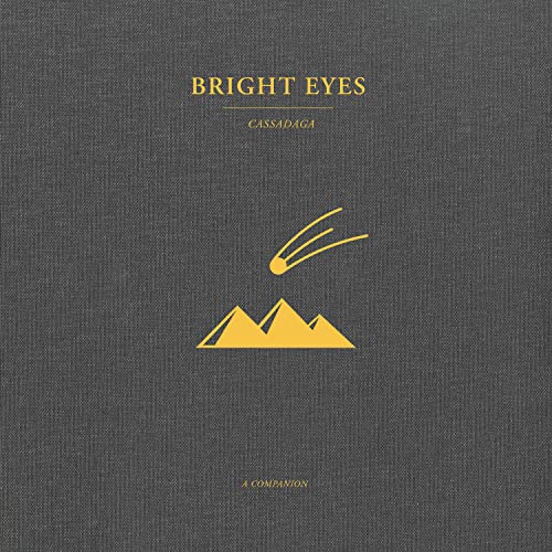 Bright Eyes’ “Cassadaga: a Companion” album cover with gold mountains and comet.