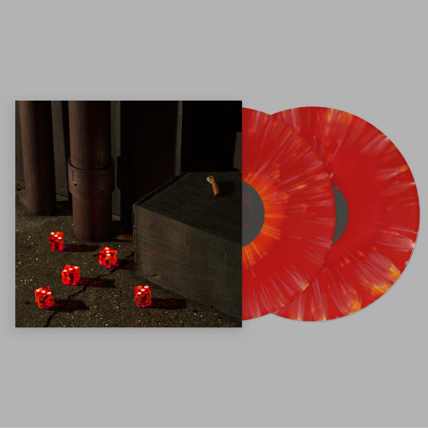 Vinyl record with orange and red swirl, and a shadowy, dice-strewn scene.