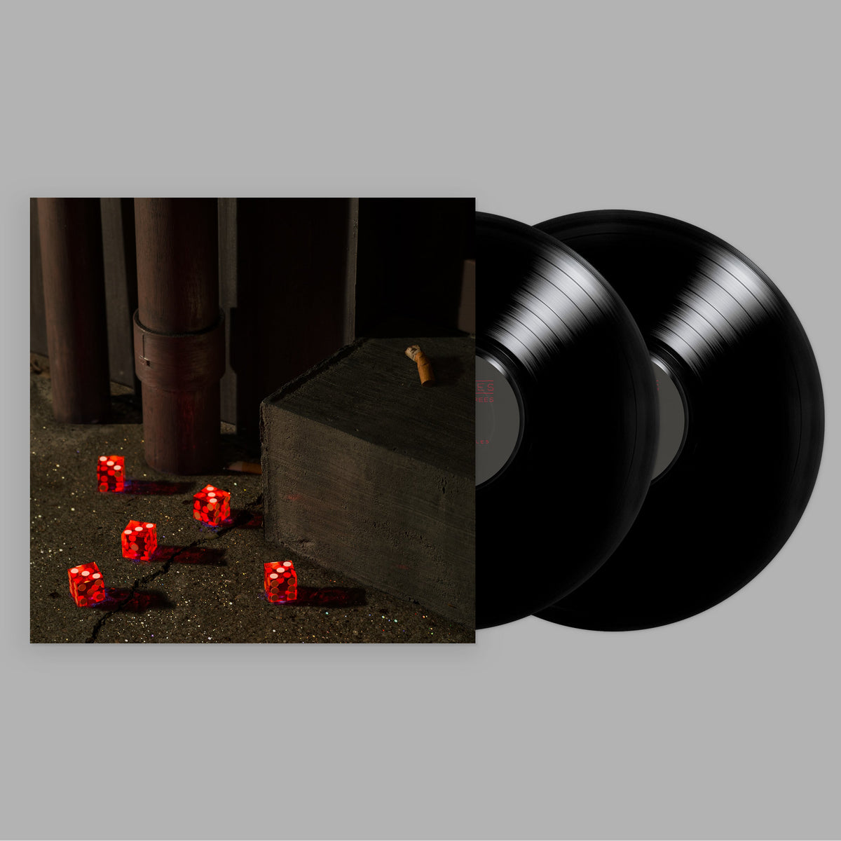Vinyl record cover with dark, moody image of dice and a cigarette.