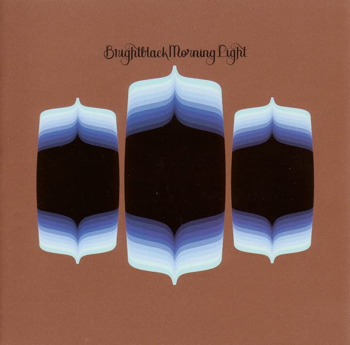 CD cover with three abstract, layered blue and white shapes on brown.