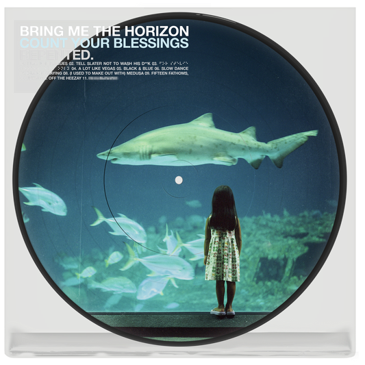 Vinyl record with image of a girl viewing sharks in an aquarium.