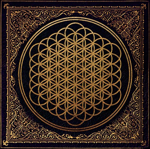 Black CD cover with ornate gold floral design and central geometric pattern.