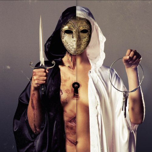 A person wearing a split black and white robe and a gold mask holding keys.
