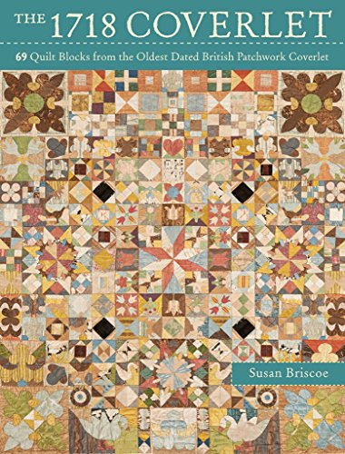 Detailed patchwork quilt coverlet with floral and geometric blocks.