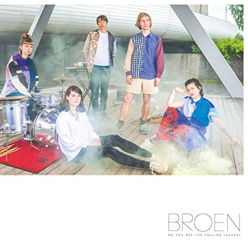 "Album cover with five young men, some sitting, surrounded by smoke on a wooden deck."