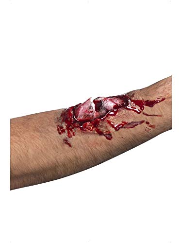 Special effects makeup of a compound fracture with exposed bone and blood on skin.