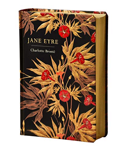 Black book cover with gold and red floral design and gold text on spine.