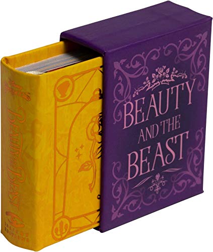 A small Beauty and the Beast book partially slid out of a purple slipcase.