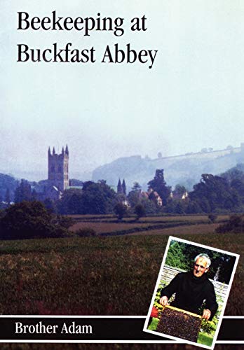 Book cover showing Buckfast Abbey in the distance and Brother Adam holding a beehive frame.