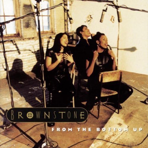 Three women singing into microphones in a studio setting on the album cover.