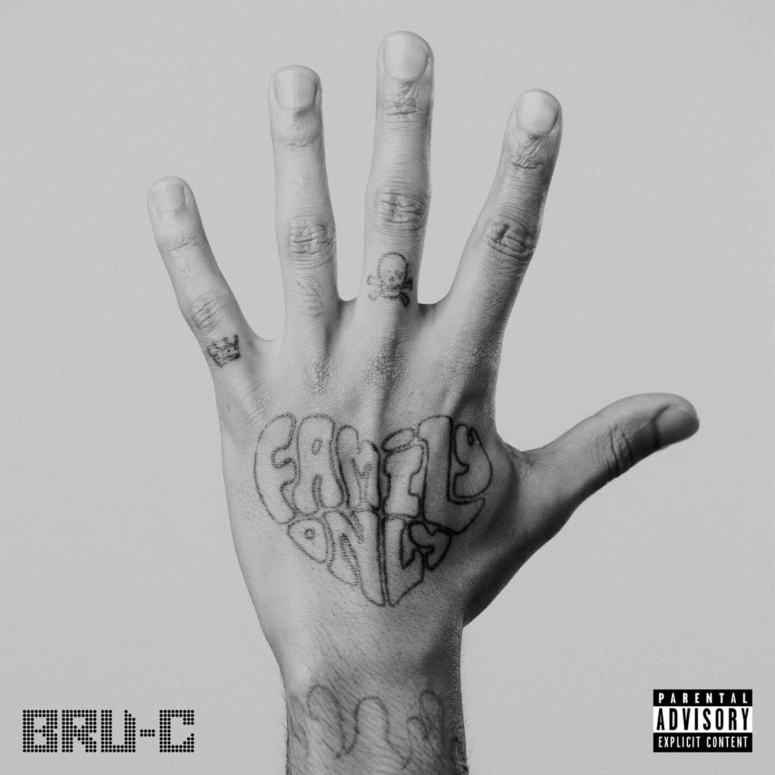 Black and white image of a hand with "Family Only" written on the palm.