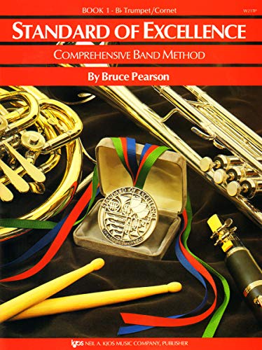 Standard of Excellence Book 1 music book cover featuring a medal, trumpet, and drumsticks.
